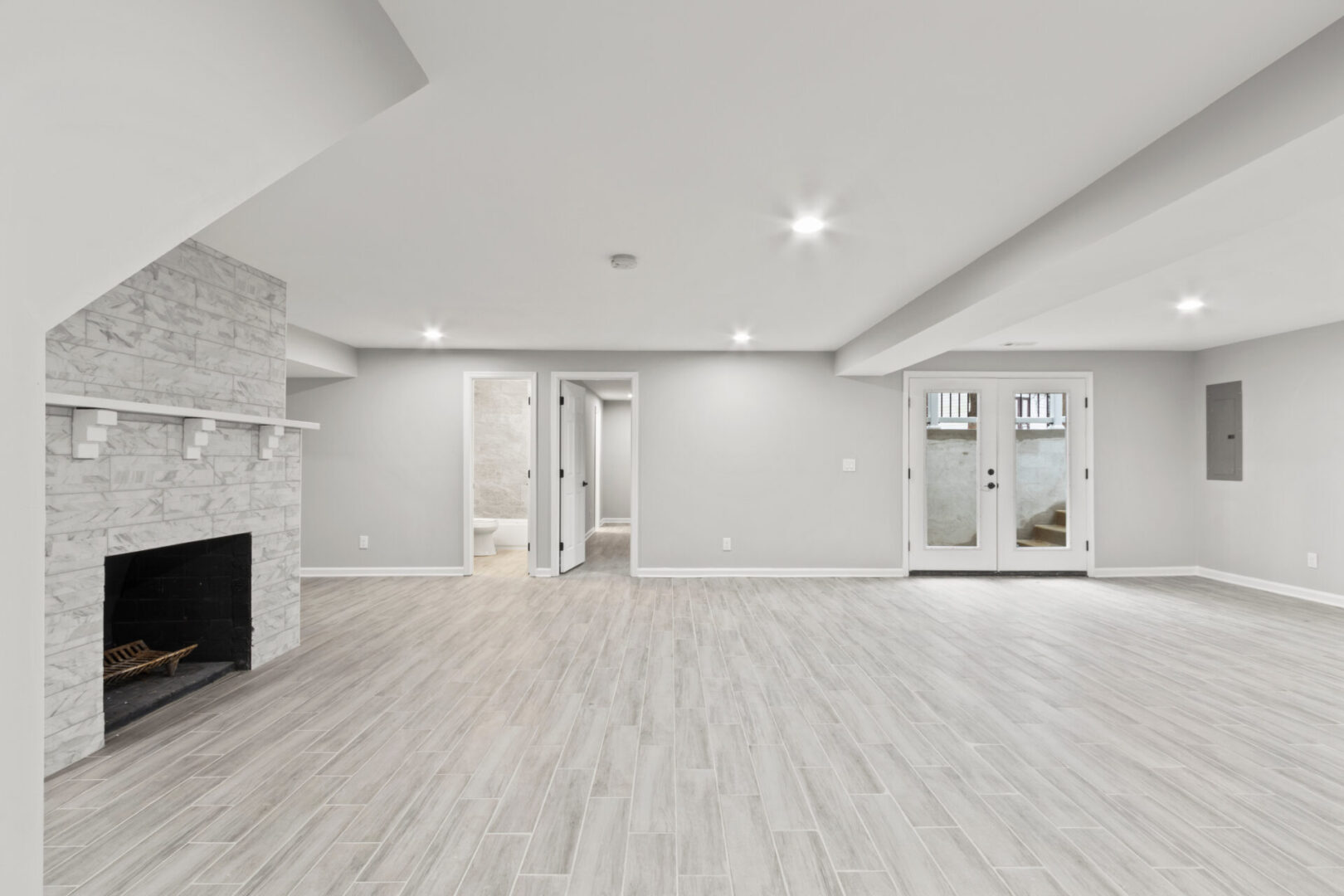 empty basement room with fireplace